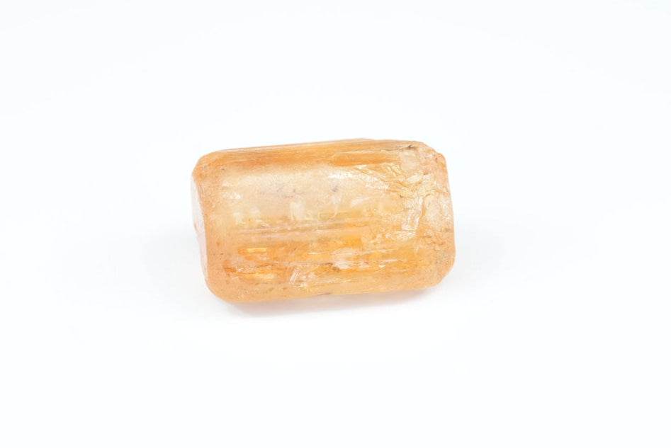 Rectangular orange Imperial Topaz on a white background