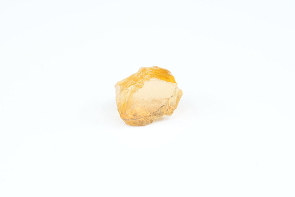 Small yellow Imperial Topaz on a white background